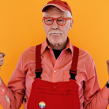 old man with red cap